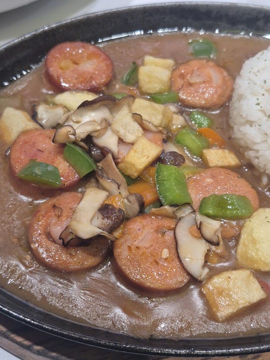 sausage and peppers in a skillet
