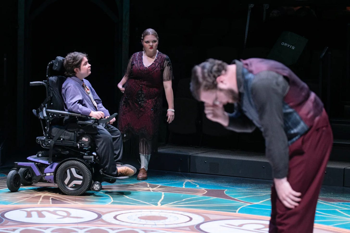 Keenan Gluck as Lysander, left, and Madison Stout as Helena, middle, rehearse “A Midsummer Night’s Dream” with Graham Bryant, as Demetrius