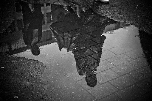 Henri Cartier-Bresson's photograph Puddle | by George Wallace | Medium