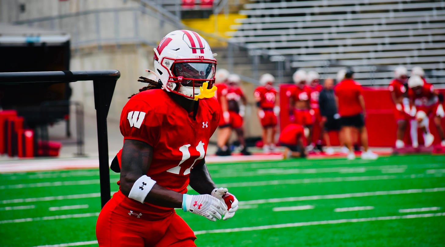 Omillio Agard participates in a defensive drill during Wisconsin Badgers fall camp practice at Camp Randall Stadium. Omillio Agard participates in a defensive drill during Wisconsin Badgers fall camp practice at Camp Randall Stadium.