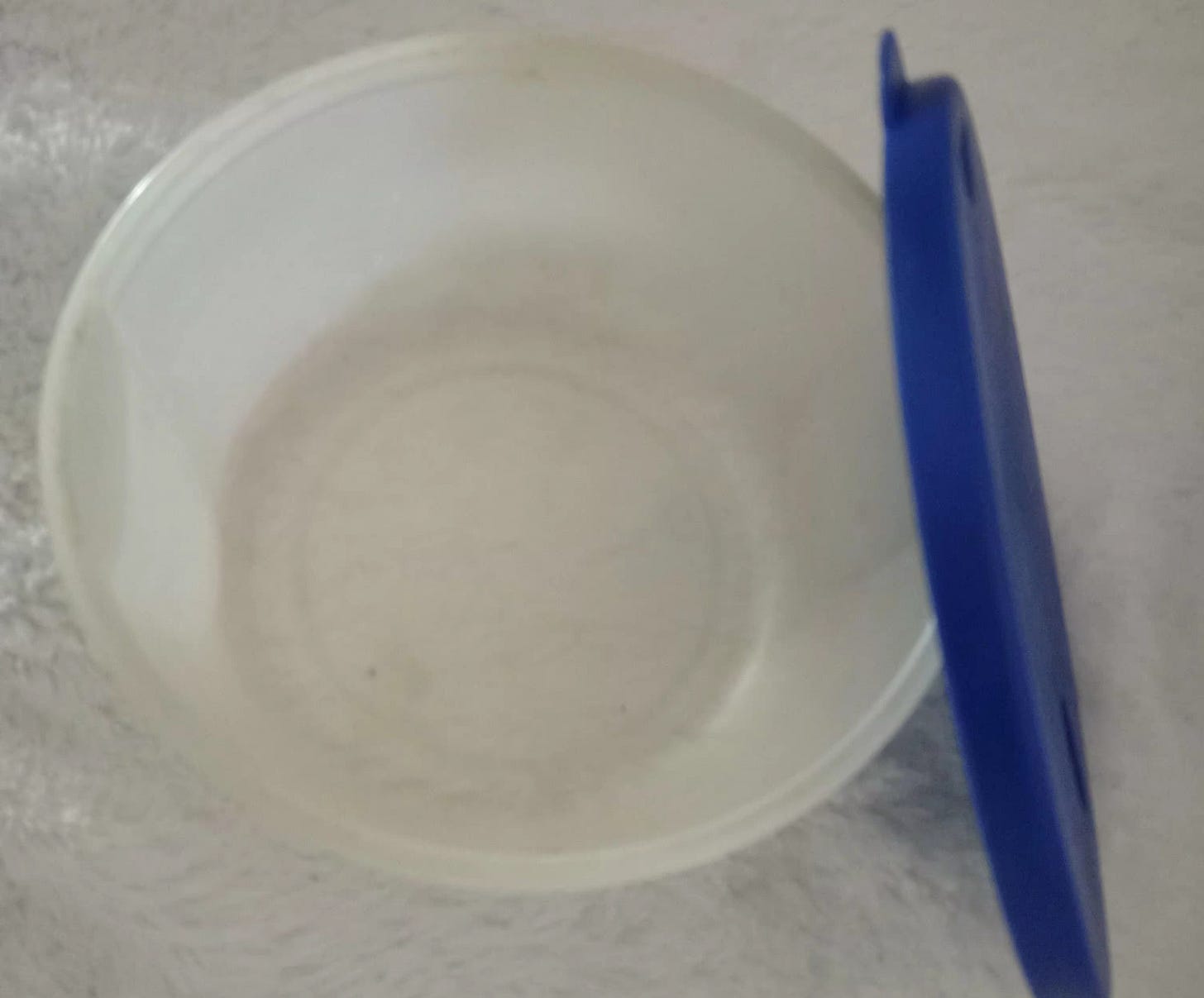 clear plastic sugar bowl with blue lid