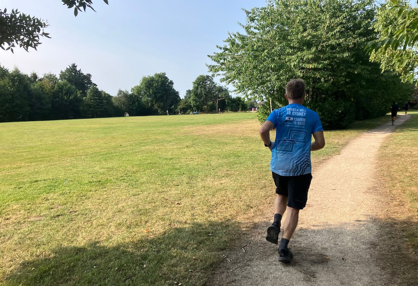 A close up of the runner ahead, on a rough path
