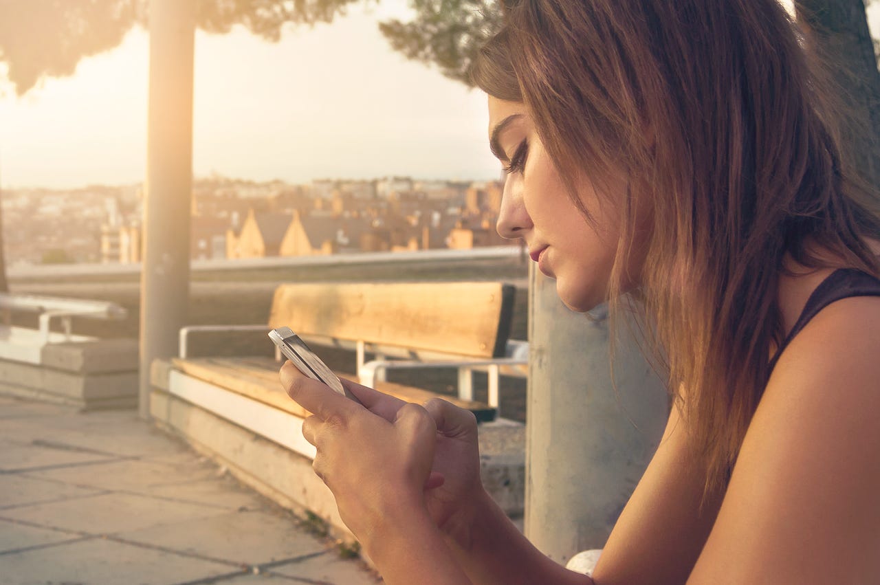 A woman staring at her phone