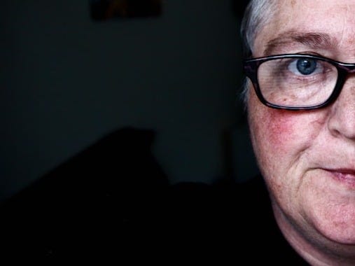 man in black crew neck shirt wearing black framed eyeglasses