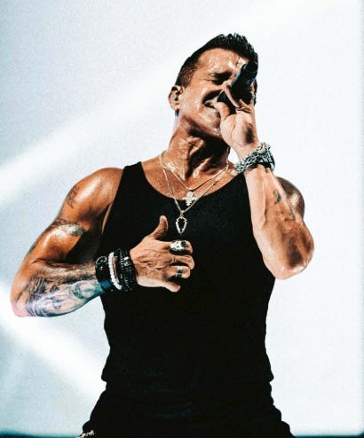 A person singing into a microphone
AI-generated content may be incorrect. A person singing into a microphone
AI-generated content may be incorrect.