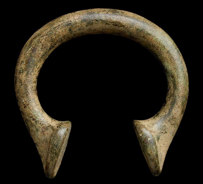 A horseshoe-shaped brass ‘Manilla’ – pre-colonial money in West Africa