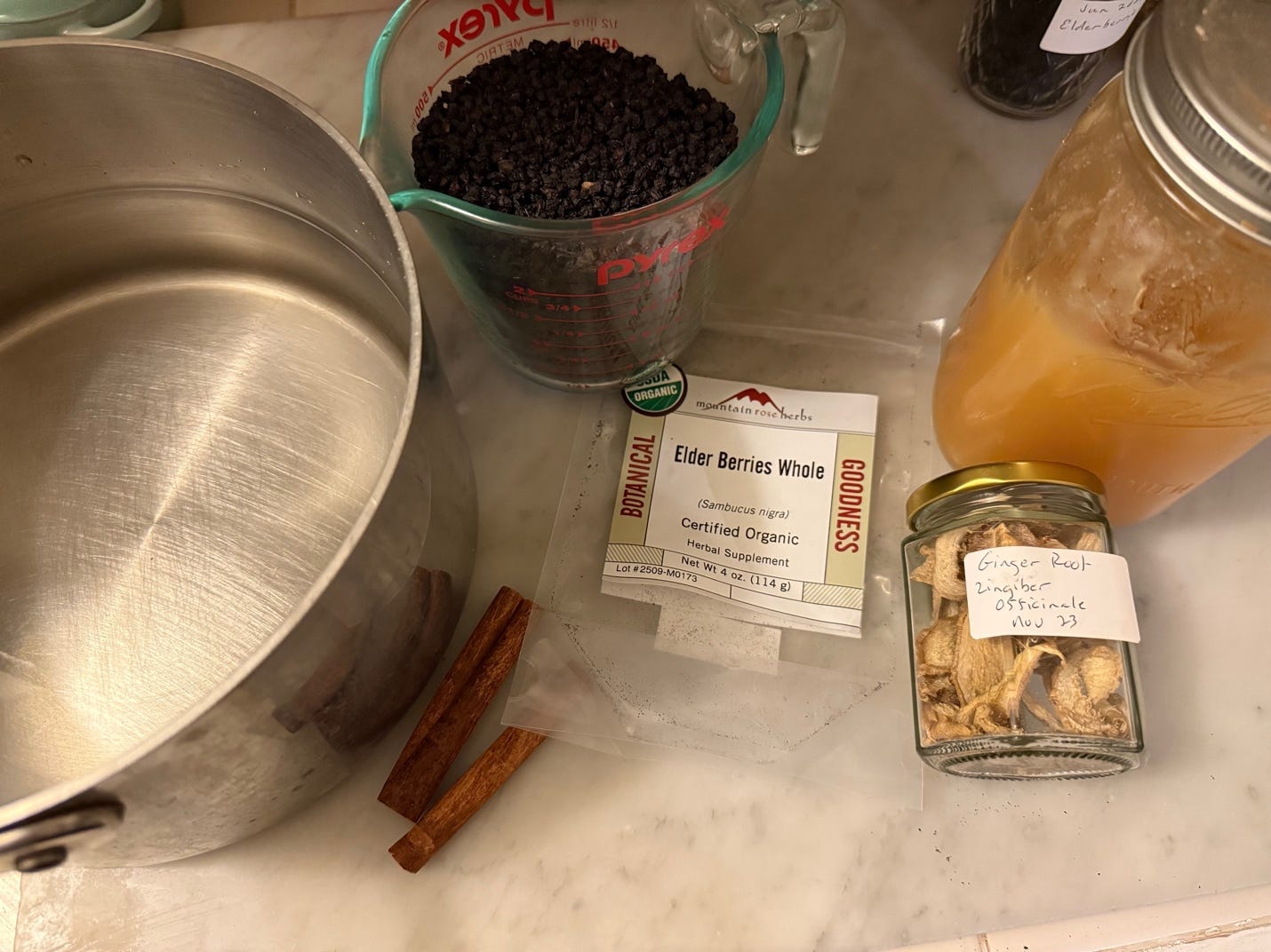 A bowl of orange juice and spices on a counter

AI-generated content may be incorrect.