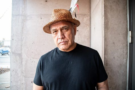 A picture of a middle aged man in a hat, a flyer on Friday's event, and a powwow flyer