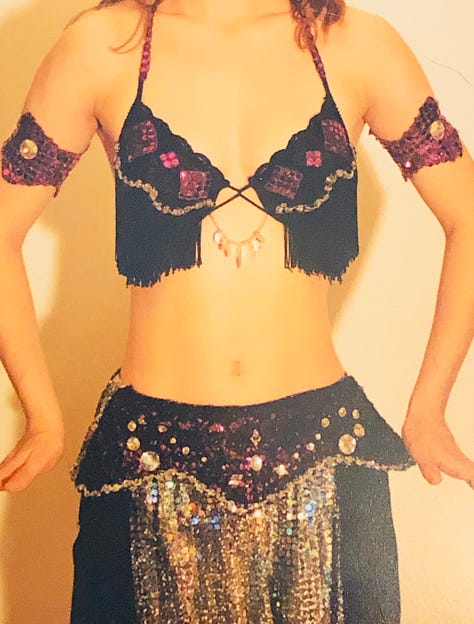 The author in a variety of belly dance costumes from her restaurant days.