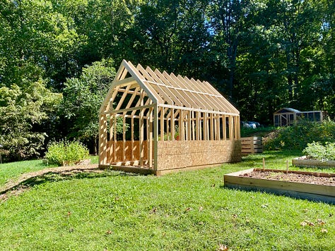 Mosaic of the greenhouse being built.