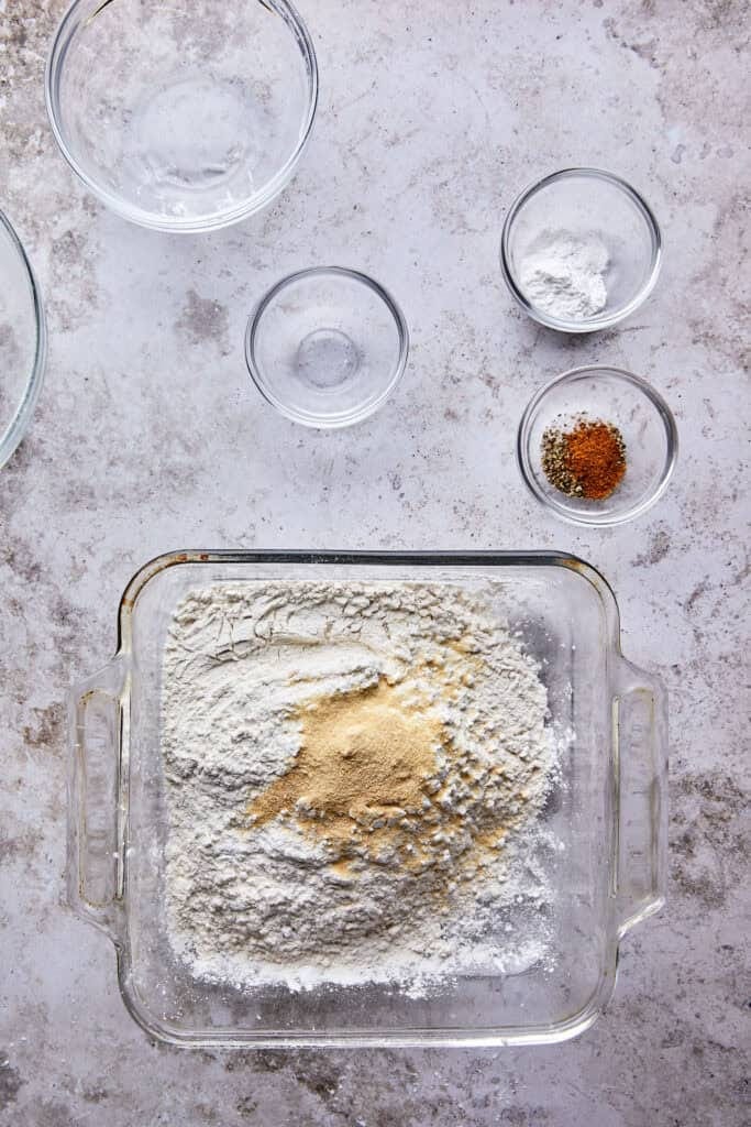 Essential dry ingredients for making the best fried chicken sandwich recipe, including flour, cornstarch, and spices for the crispy coating.
Essential dry ingredients for making the best fried chicken sandwich recipe, including flour, cornstarch, and spices for the crispy coating.
