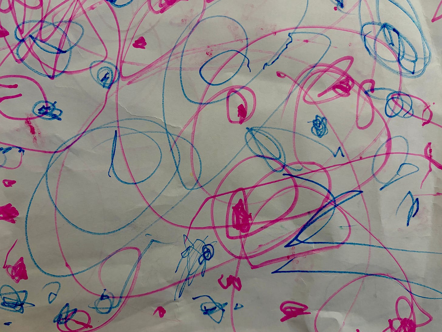 A child's bright blue and pink artwork A child's bright blue and pink artwork