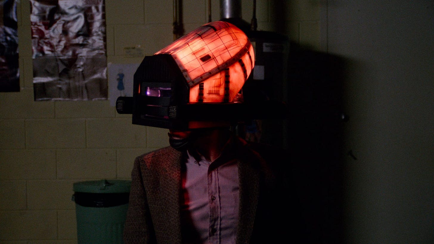 Videodrome | Still features a man whose head is inside of a glowing helmet.