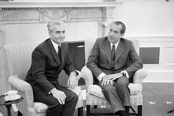 The Shah of Iran, Mohammed Reza Pahlavi , left, sits with American politician Richard Nixon , president of the United States, at the White House,...