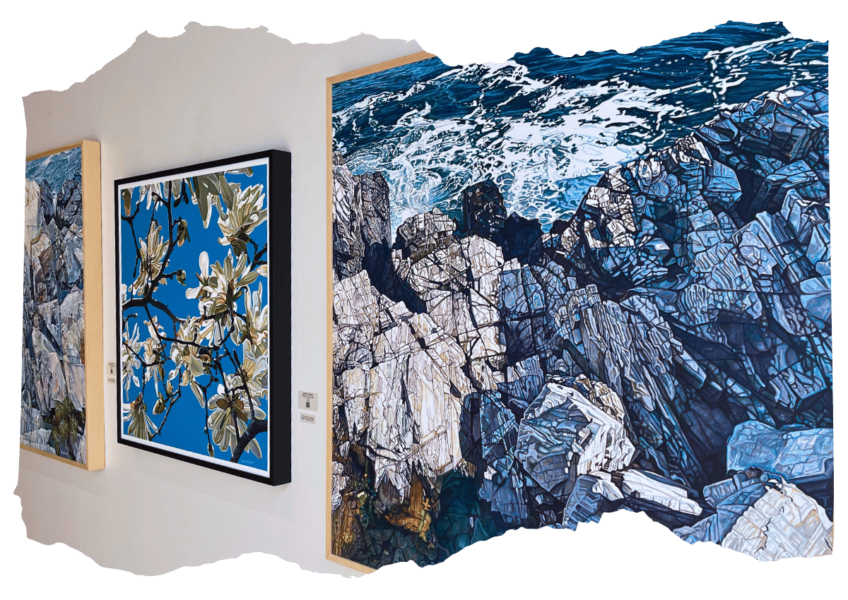Interior of an art gallery displaying three large paintings: one featuring white blossoms against a blue sky, another depicting rugged coastal cliffs, and a third with detailed ocean waves
