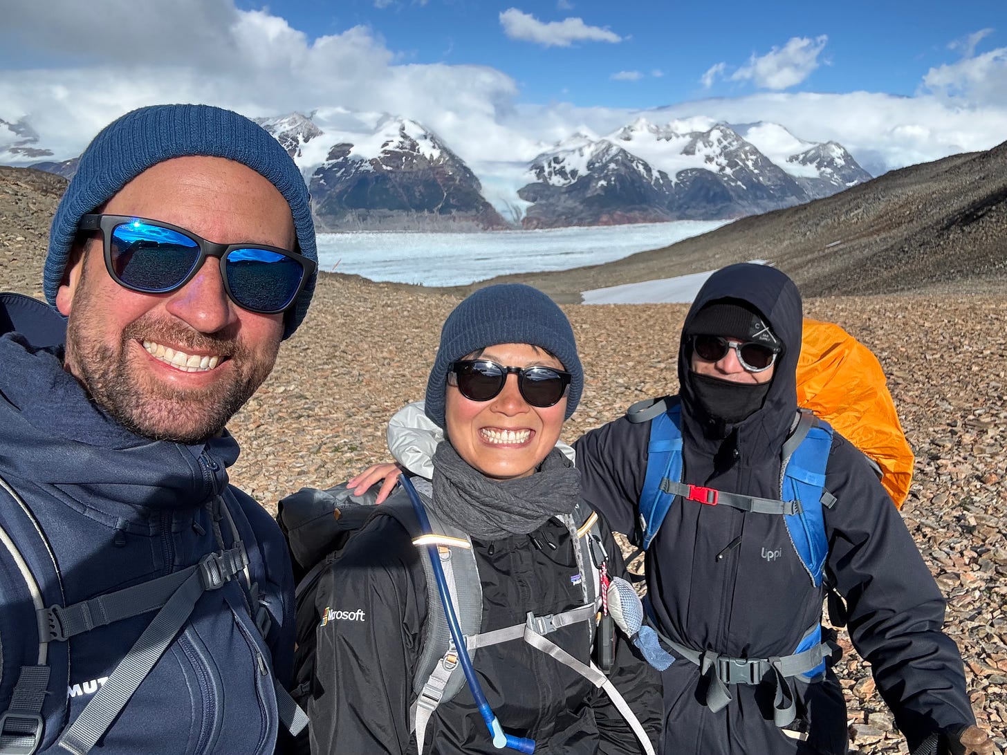 Three hikers smiling for a selfie Three hikers smiling for a selfie