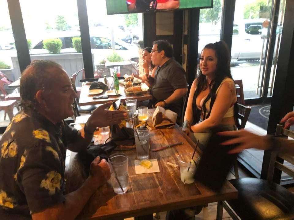 May be an image of 3 people, table, sushi and drink