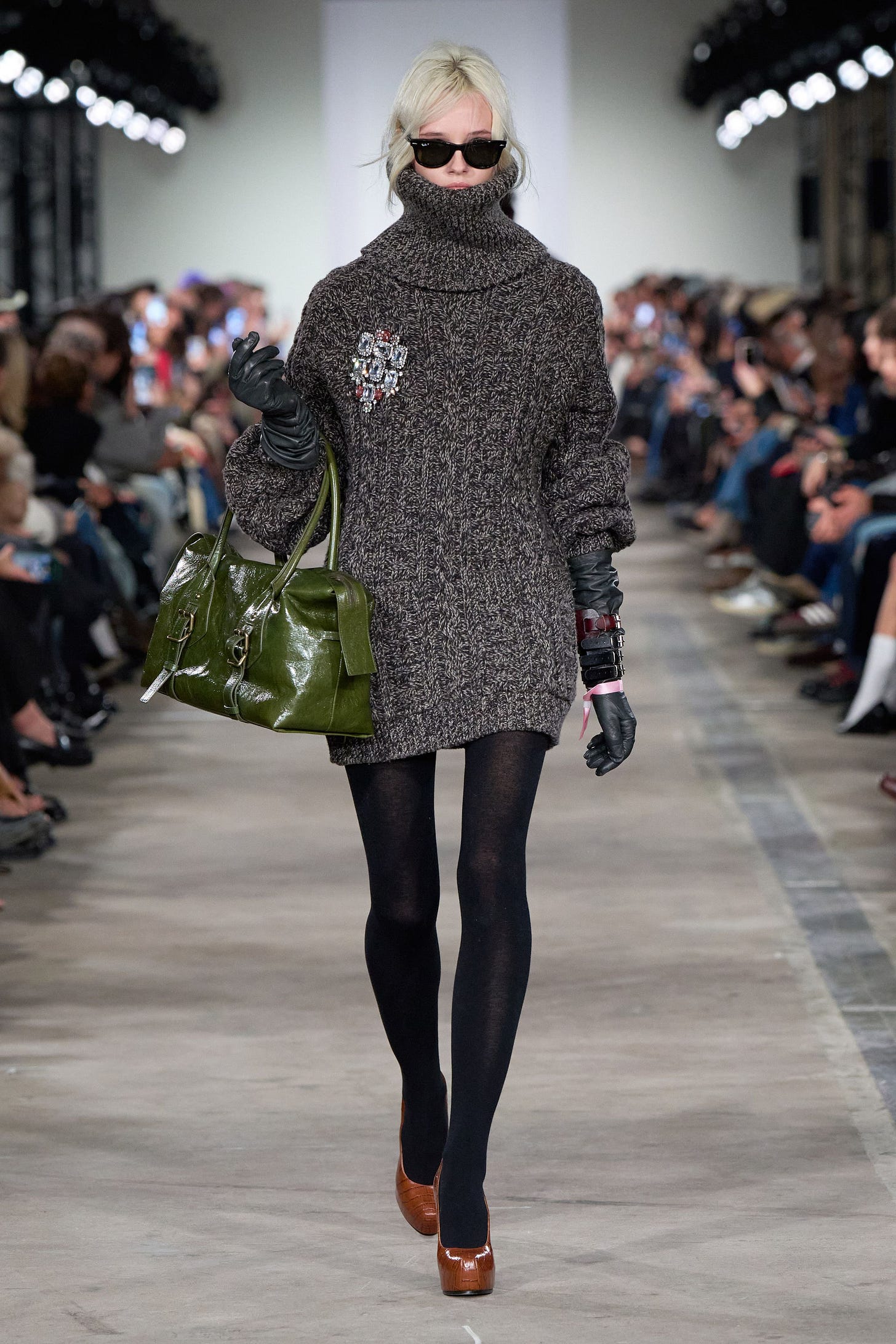 Image may contain Adult Person Clothing Glove Accessories Bag Handbag Knitwear Sweater and Hosiery Image may contain Adult Person Clothing Glove Accessories Bag Handbag Knitwear Sweater and Hosiery