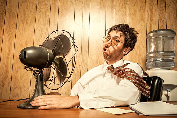 business man in office with fan - summer heat stock pictures, royalty-free photos & images