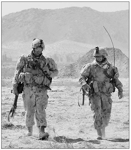 LCol Taylor with one of her many mentors in the Canadian Army, MWO Jim Blackmore. The pair deployed together to Kosovo, Bosnia and then to Afghanistan. Summer 2010. Photo provided by LCol Eleanor Taylor. 
