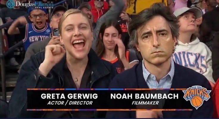 This may contain: two men in front of a crowd with their mouths open and one man holding his hand up