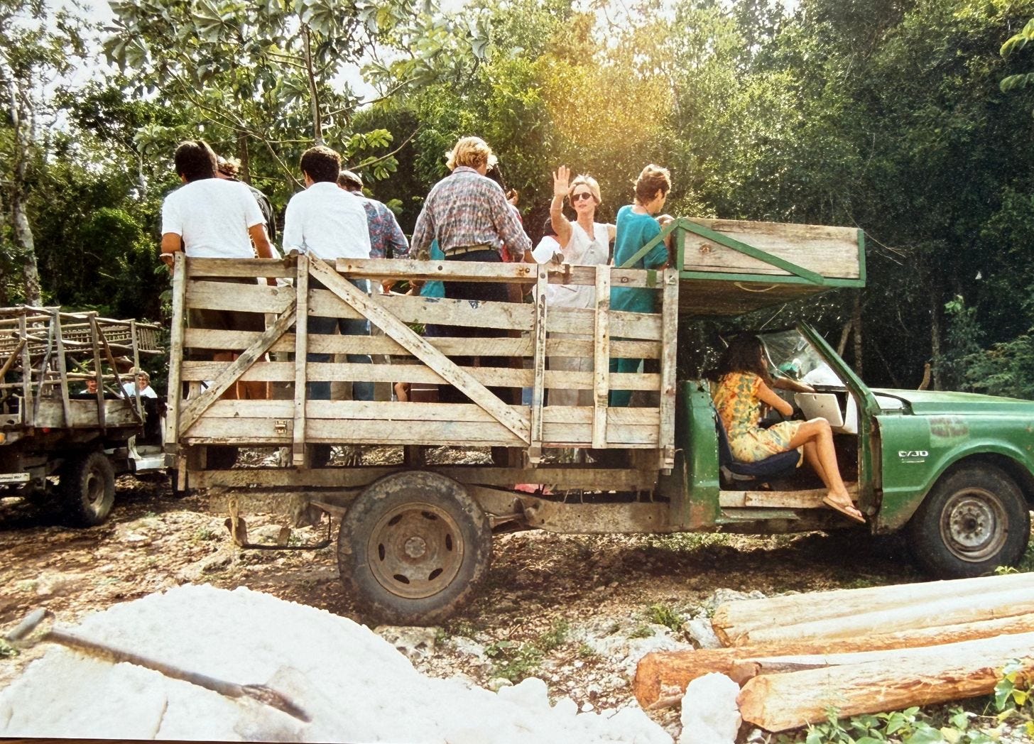 Kay Walten waving from the truck in the yucatan jungle