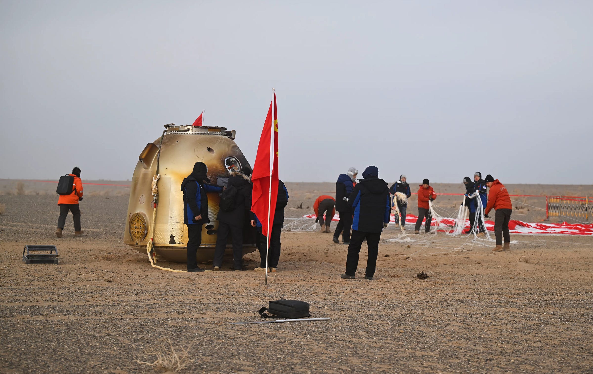 The Shenzhou-20 spacecraft’s reentry module being secured by recovery teams following its return to Earth on January 19th 2026.