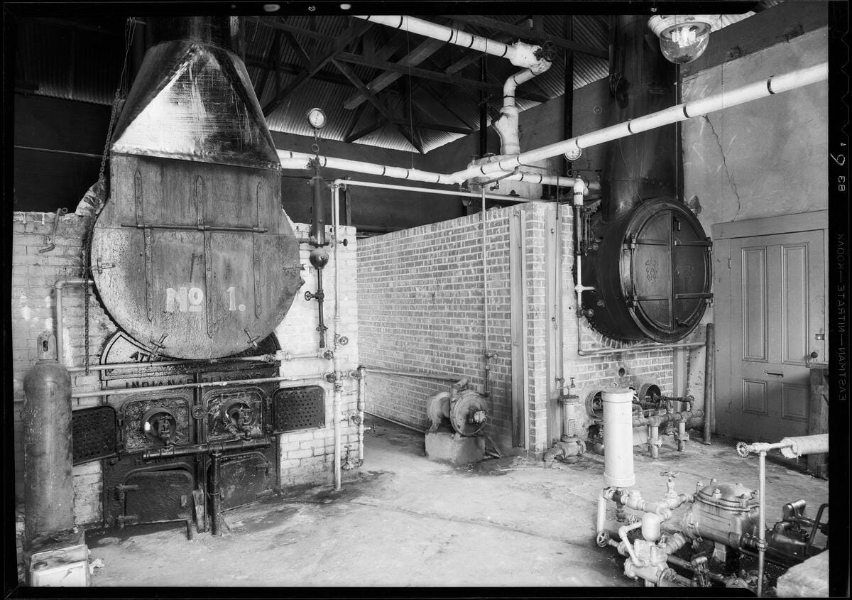 Photograph of the interior of McClure's Winery in Burbank, California, in 1931, showing an industrial boiler marked "No. 1" and related winemaking equipment. Photograph of the interior of McClure's Winery in Burbank, California, in 1931, showing an industrial boiler marked "No. 1" and related winemaking equipment.
