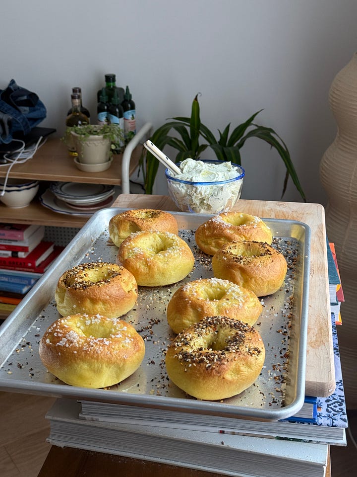 egg bagels on a sheet tray and a photo of a bagel with lox tomato and onion