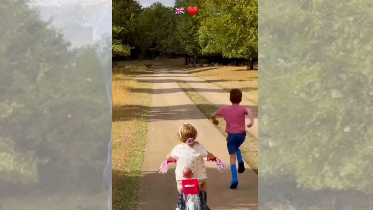 image of Prince Archie cheered on little sister Princess Lilibet as she rode her bike with a doll sitting behind her. image of Prince Archie cheered on little sister Princess Lilibet as she rode her bike with a doll sitting behind her.