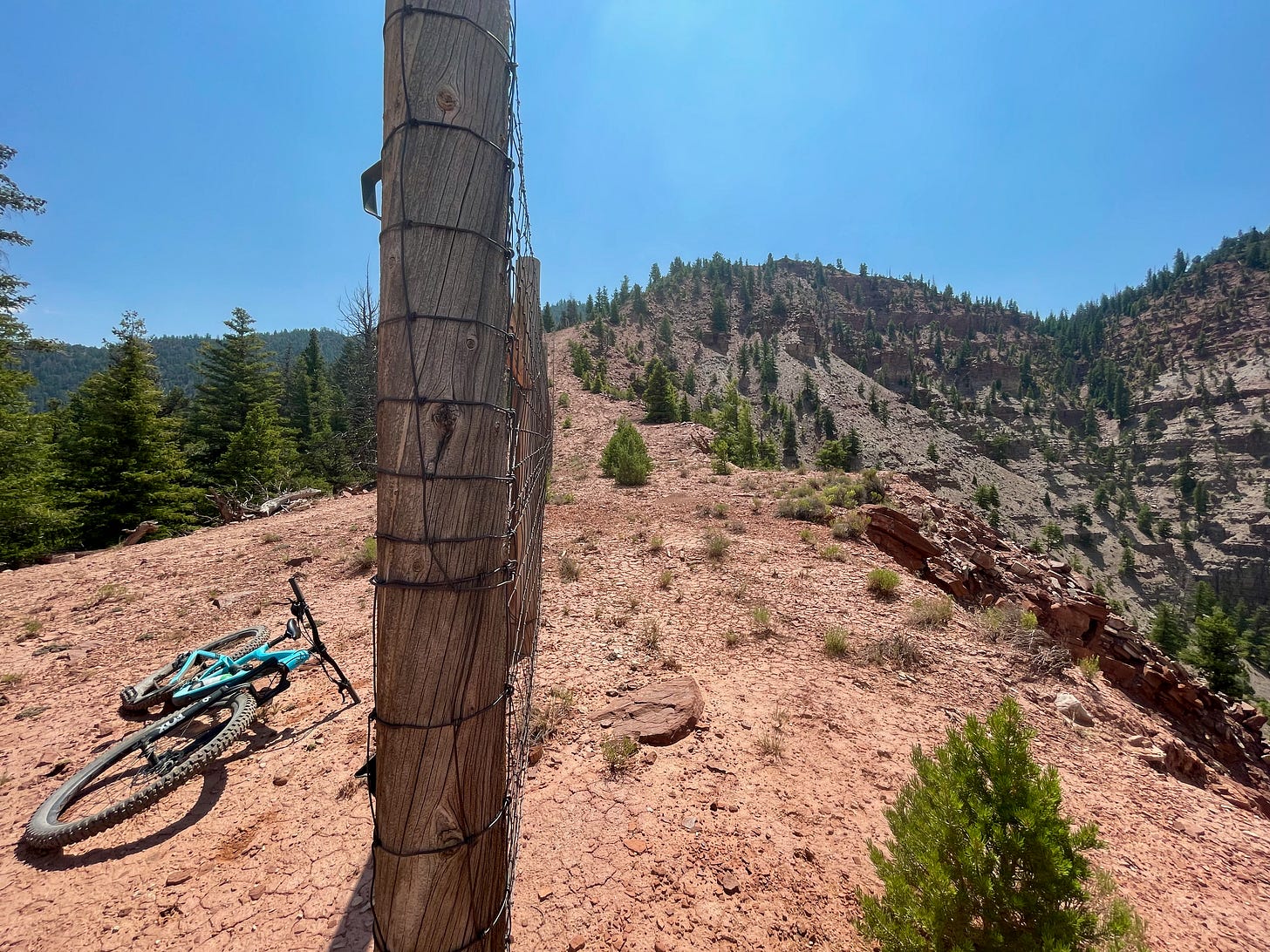 Fence protecting access to red mountain cliffs