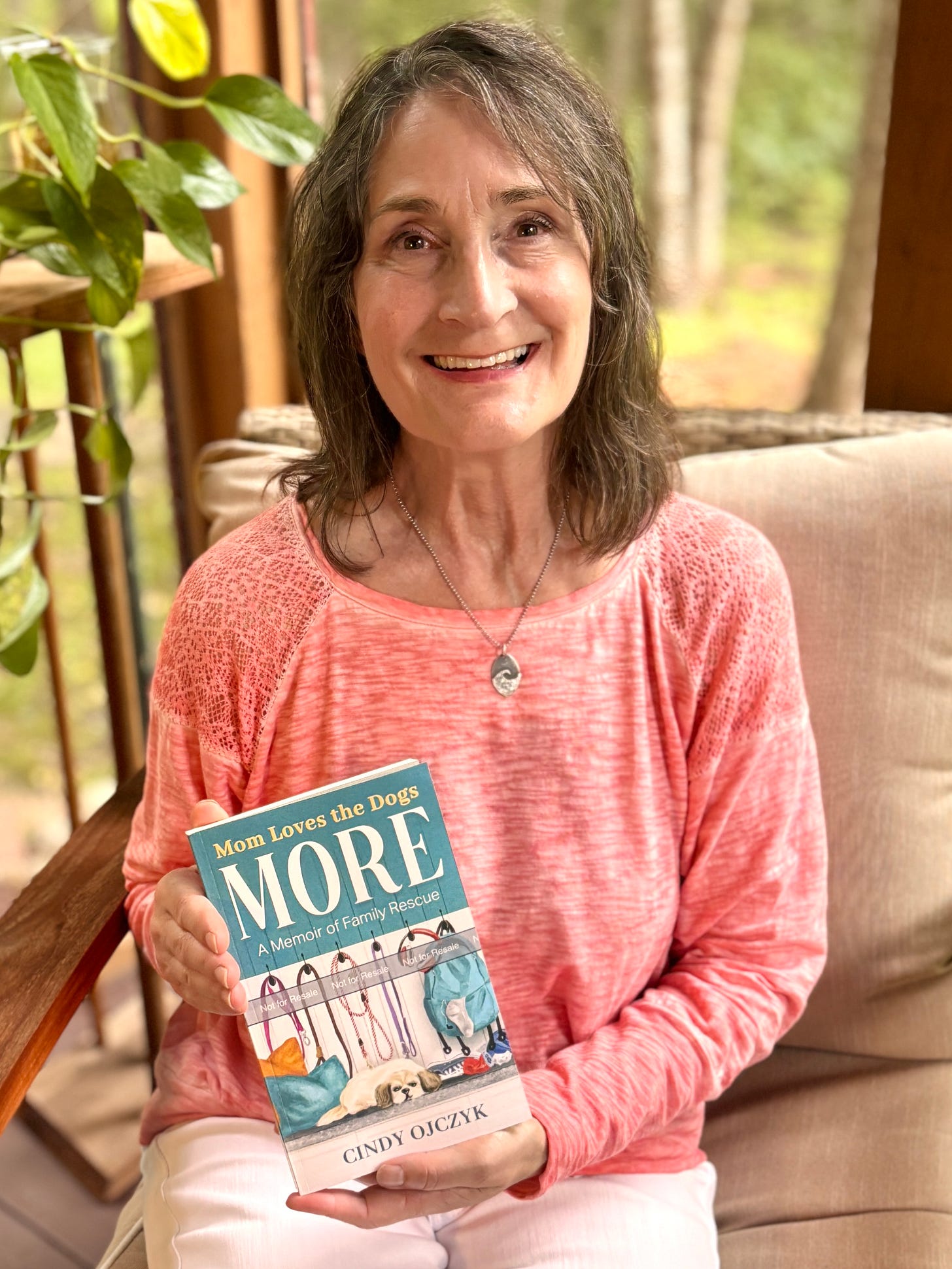 woman sitting and holding a book