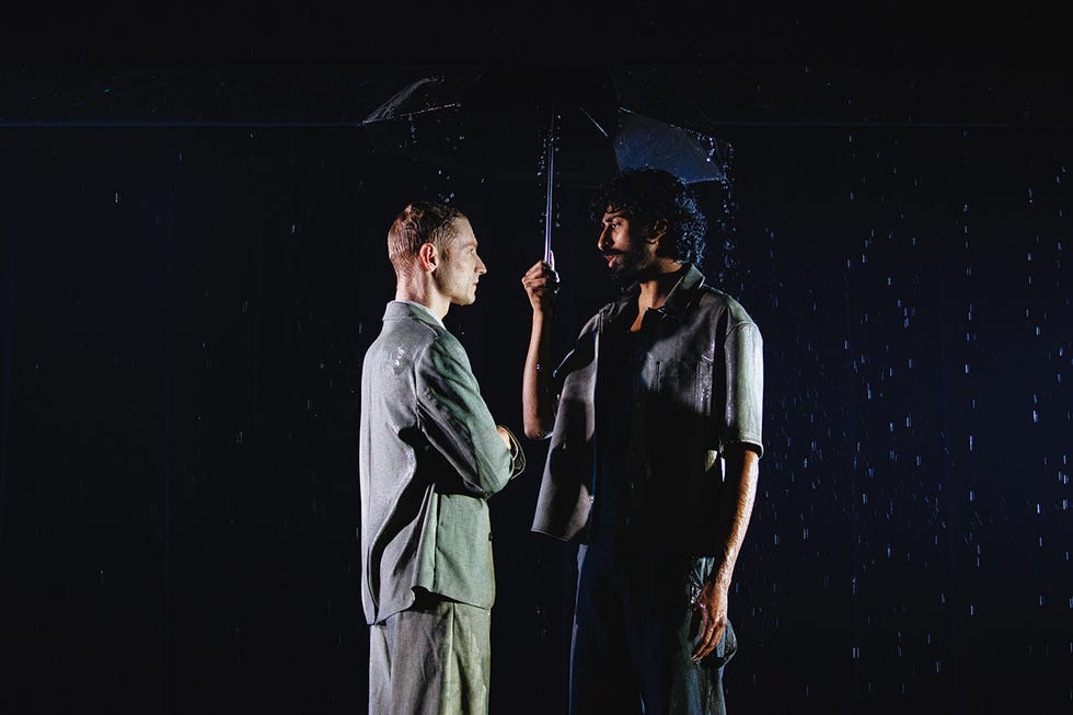 McCrea and Kumar stand suggestively close to each other in the rain McCrea and Kumar stand suggestively close to each other in the rain