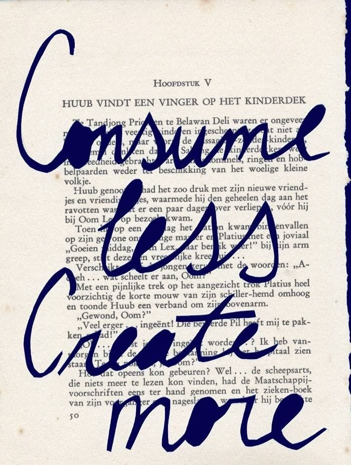 This may contain: an old book with blue ink that reads consume less hate more on the front page
