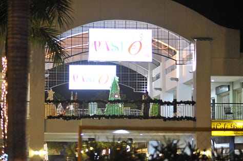 Doorways, stairs, amphitheater, shopping. Places and people of change.