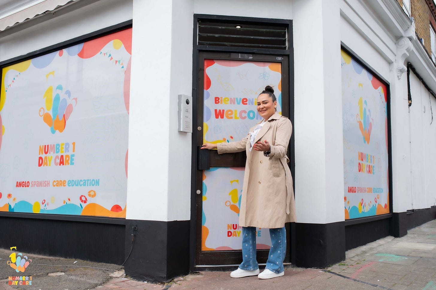 May be pop art of 1 person, overcoat, duffel coat, cornflower and text that says "- Bienve e WELCO NUMBER1 NU DAY CAR ANGLO SPANISH ANGLOSPANISHCaReeDUCaTION CaRe eDUCaTiON MG JAY NUI DAY NUMBER1 DAYCARE"