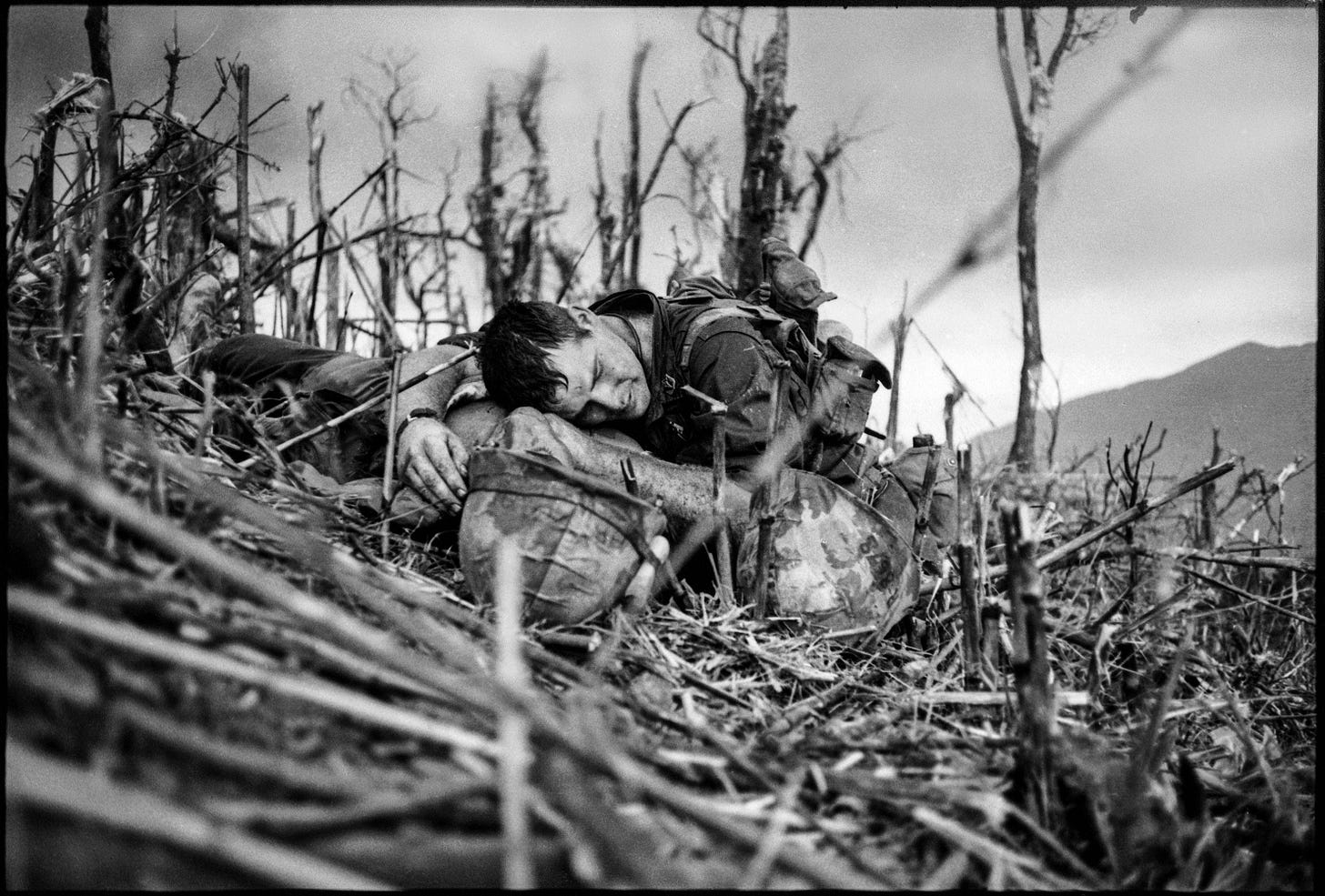 U.S. Navy corpsman Vernon Wilke with a mortally wounded Marine near Khe Sanh, April 1967.