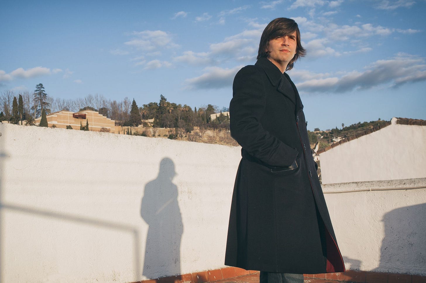 photograph of Fernando Valverde outside in a black coat.