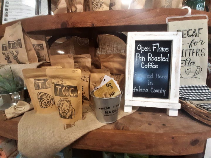 Pictures of different items for sale at the Round Barn including coffee, breads and mizes.