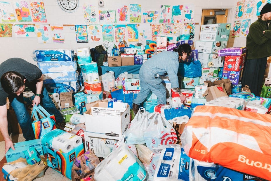 Toiletries and childcare products are collected in a room by organizers