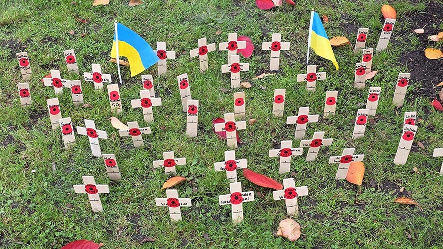 Crosses for each British Defender who has died in Ukraine.