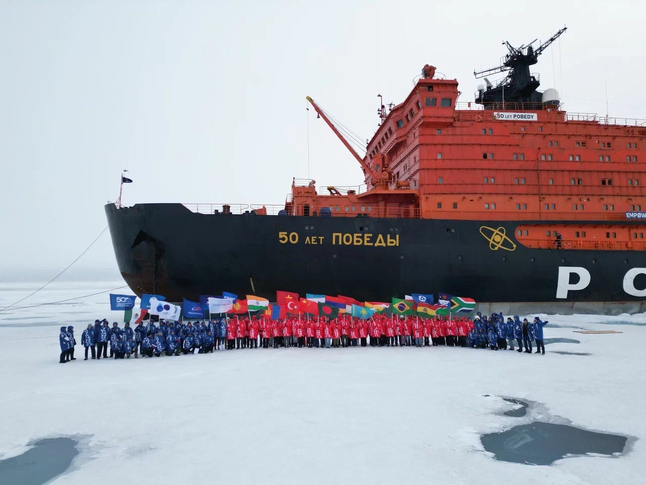 "Students from 21 countries aboard Rosatom’s nuclear icebreaker 50 Let Pobedy celebrate reaching the North Pole on August 17, 2025, during the Icebreaker of Knowledge expedition." "Students from 21 countries aboard Rosatom’s nuclear icebreaker 50 Let Pobedy celebrate reaching the North Pole on August 17, 2025, during the Icebreaker of Knowledge expedition."