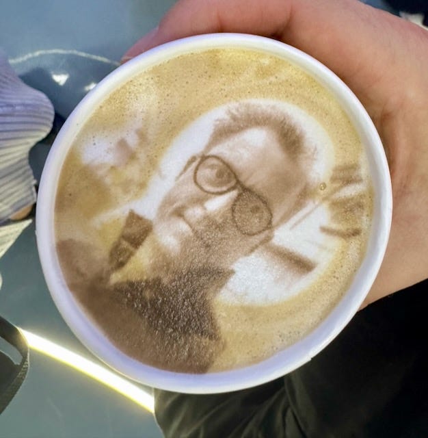 The finished cup, my face printed into the foam by Anno’s AI module. Qianhai, May 2026.