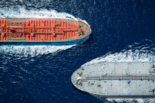 Aerial overhead view of two large crude oil tanker crossing the ocean Aerial overhead view of two large crude oil tanker crossing the ocean