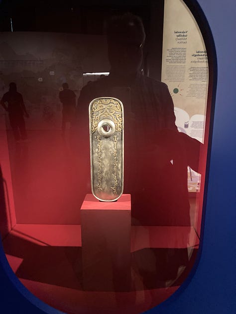 Pictures of a ceramic camel, a pizza, the seal of a General, a Garuda mask, a yurt, a lovely lady looking at a Yama, a map, and a timeline.