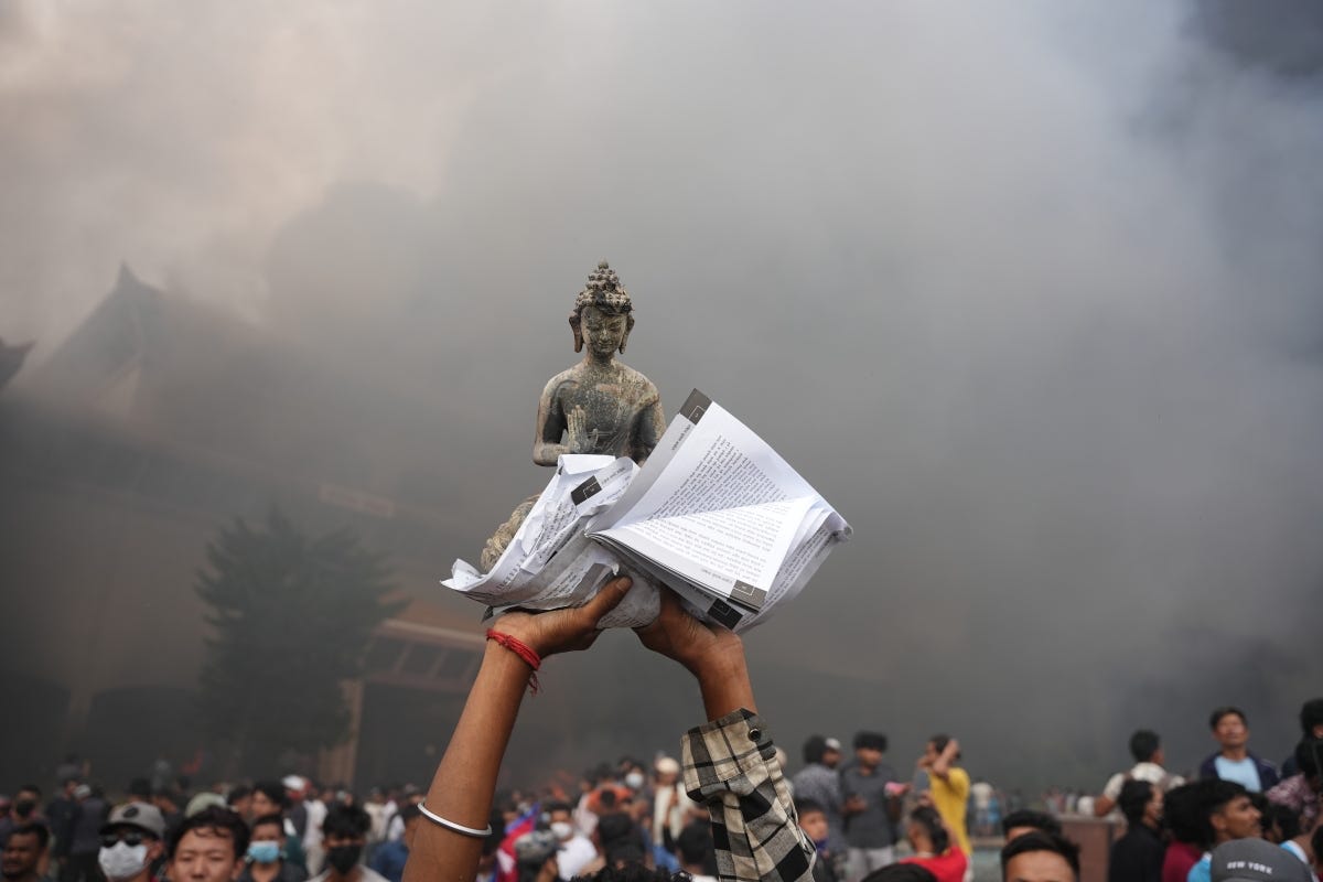 A protester holding up an idol of Gautam Buddha at the protest in Kathmandu, Nepal. Photo: AMIT MACHAMASI/Nepali Times. A protester holding up an idol of Gautam Buddha at the protest in Kathmandu, Nepal. Photo: AMIT MACHAMASI/Nepali Times.
