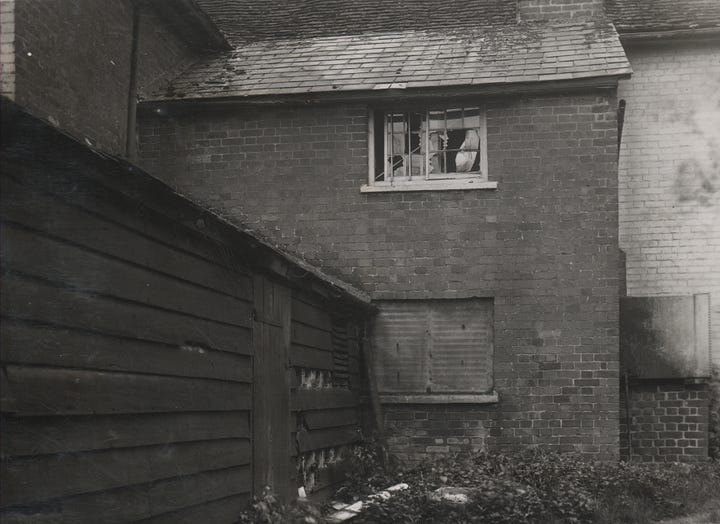 A series of photos showing bomb damage from an accidental detonation. A car is smashed up, there are craters in the ground and the windows of nearby buildings are completely destroyed.