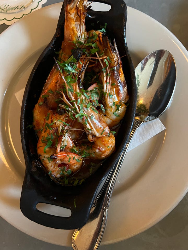 hot honey shrimp in a cast iron pan from slim's pizzeria