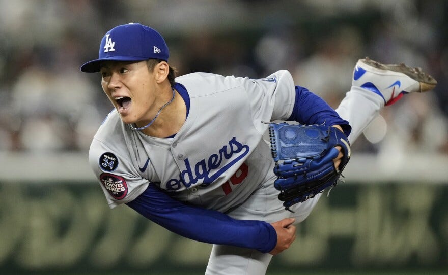 Los Angeles Dodgers starting pitcher Yoshinobu Yamamoto throws to the Chicago Cubs in the fifth inning of an MLB Japan Series baseball game in Tokyo, Japan, Tuesday, March 18, 2025. (AP Photo/Hiro Komae)