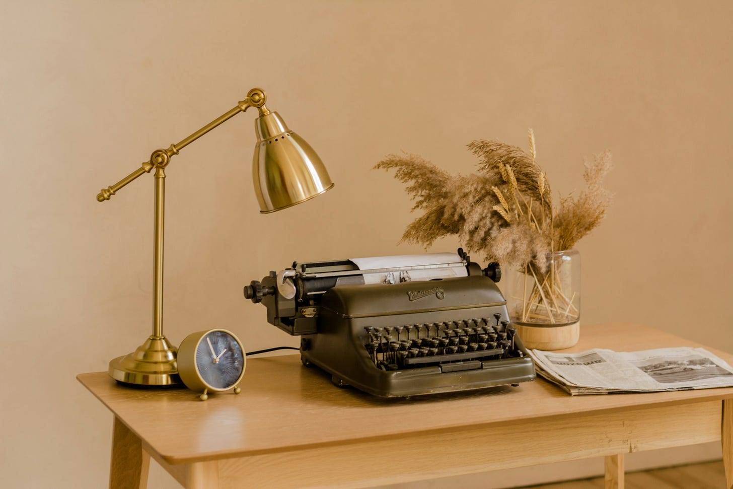 Old typewriter on table with a lamp. Photo by Eugenia Pankiv on Unsplash. Old typewriter on table with a lamp. Photo by Eugenia Pankiv on Unsplash.